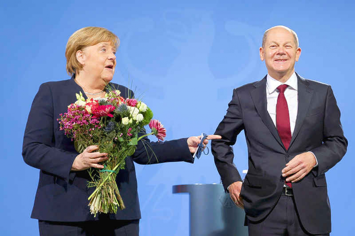 Scholz takes over as German chancellor, ending Merkel era